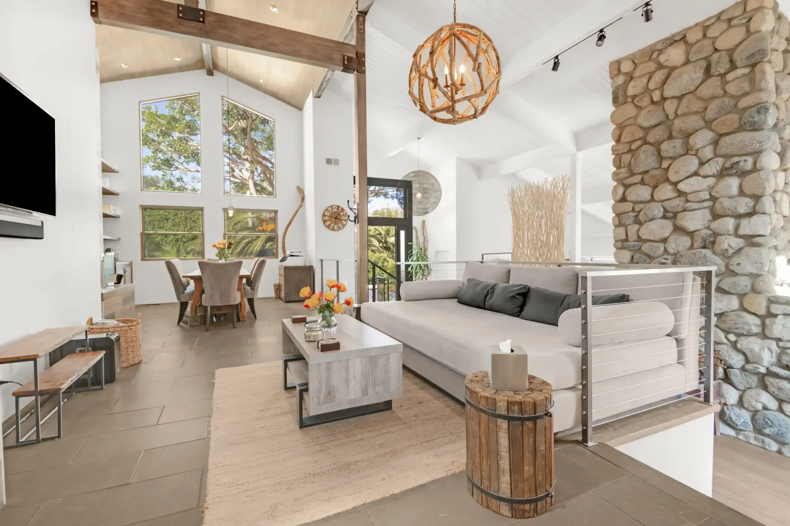 The kitchen sitting area inside Amend Malibu's residence, bright with natural light