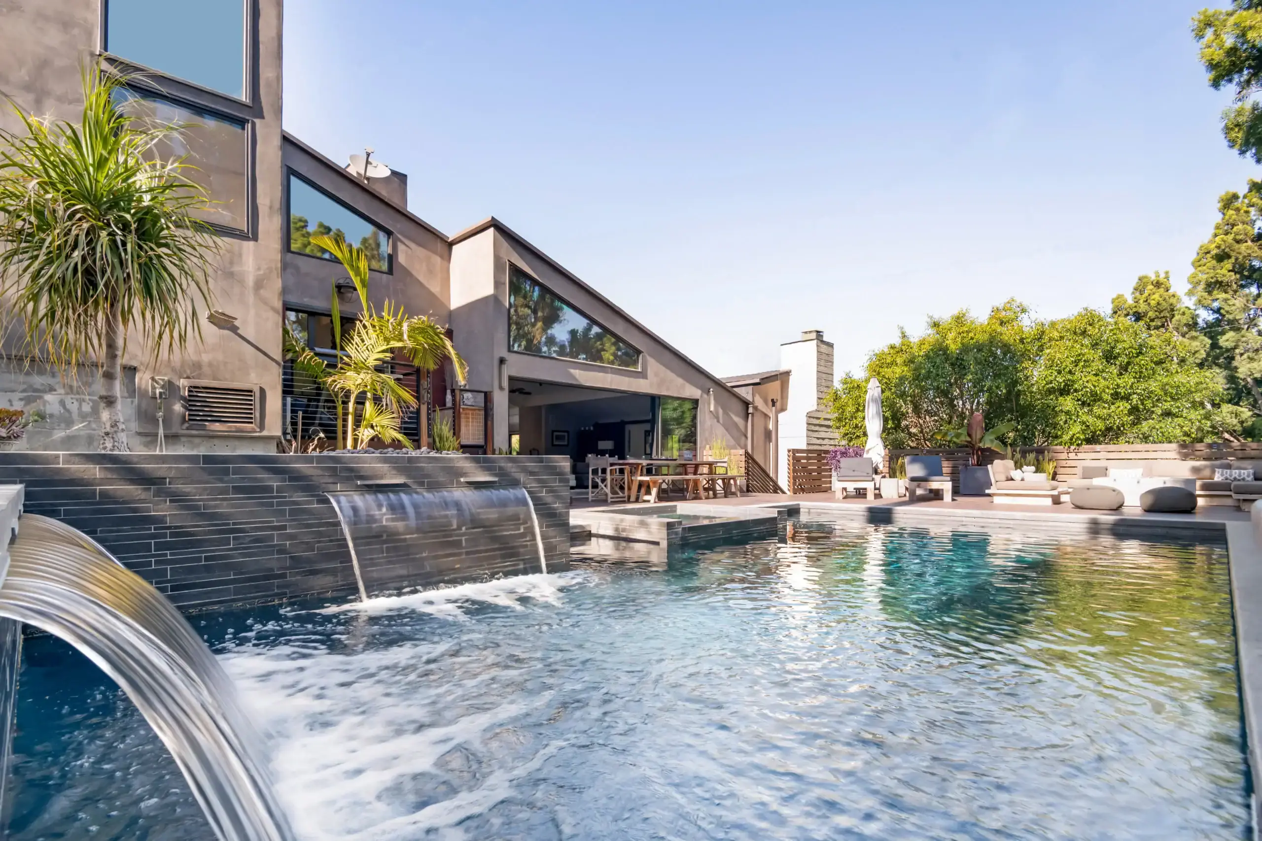 The infinity pool and grounds of a private residential mental health house above the Malibu coast