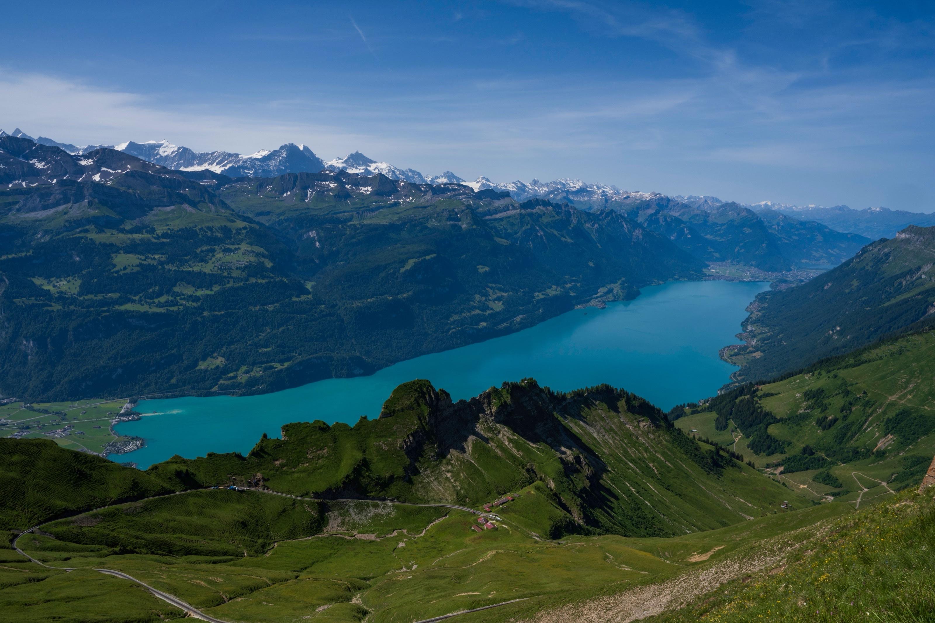 Aerial view of turquoise Lake Brienz from the Brienzer Rothorn ridge, with snow-capped Bernese Alps beyond, Switzerland