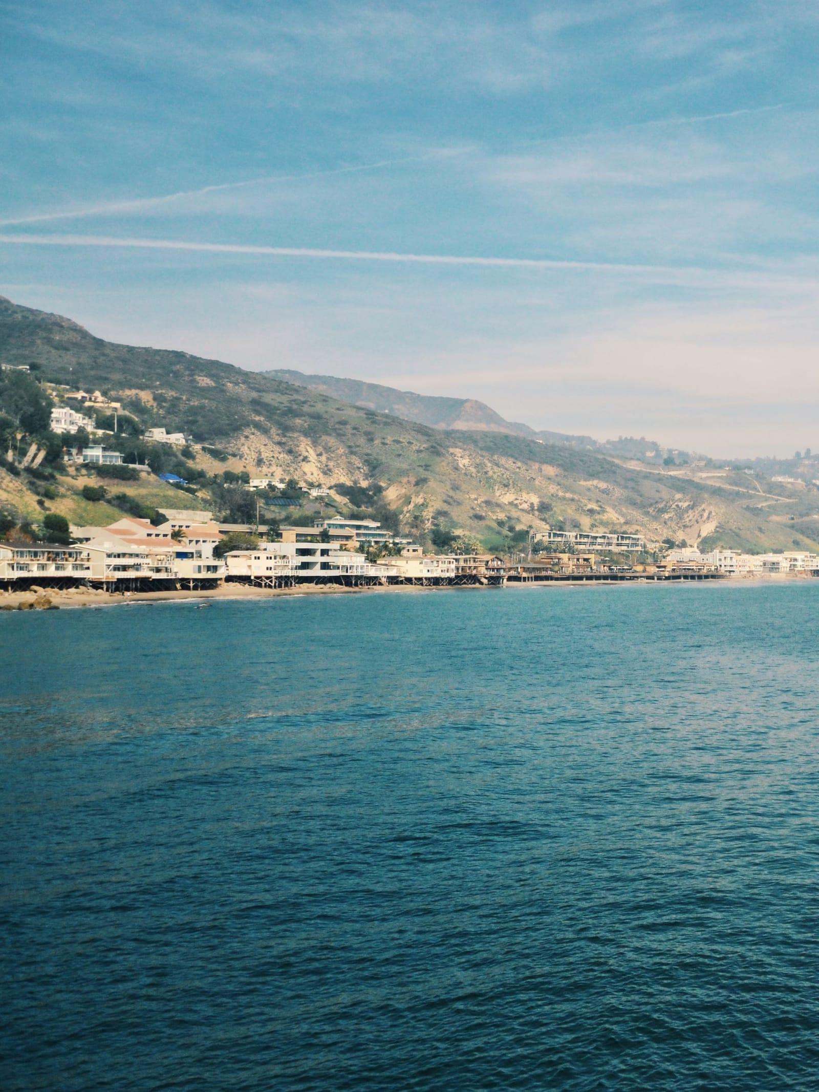 Malibu hillsides and homes rising above the ocean