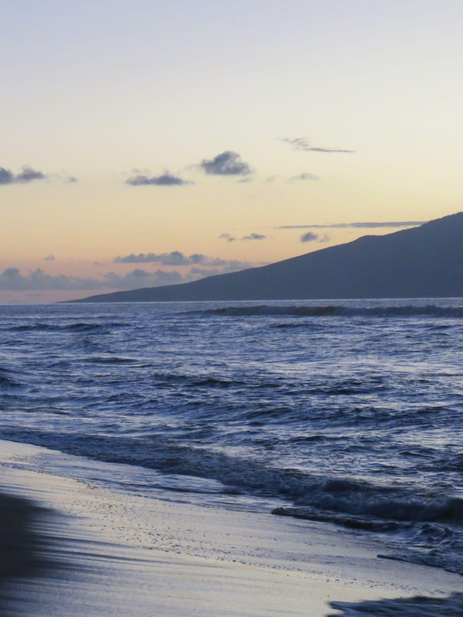 Calm water at Kaanapali Beach in West Maui as the sun goes down