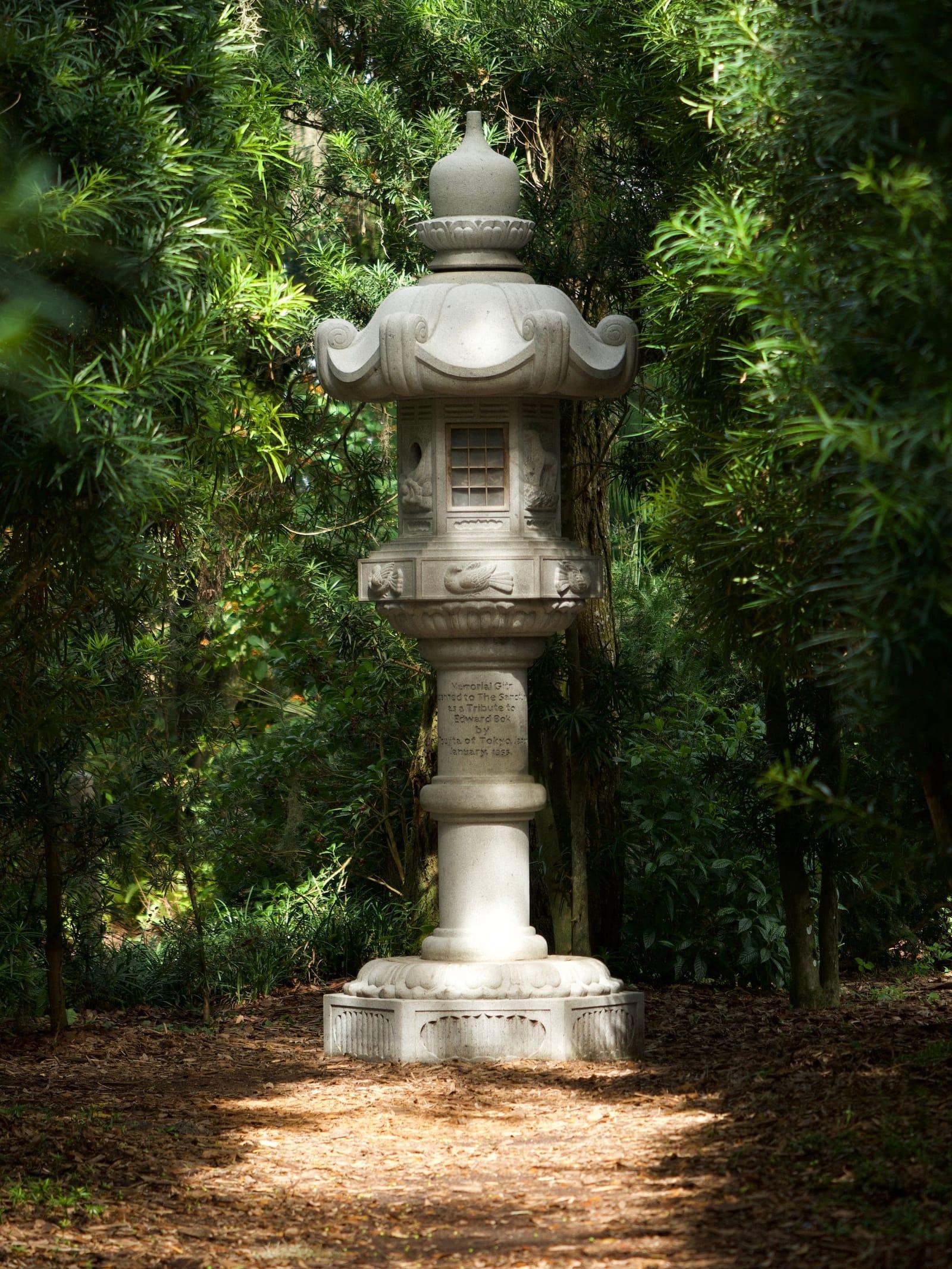 A stone lantern in the shaded gardens at Bok Tower in Lake Wales