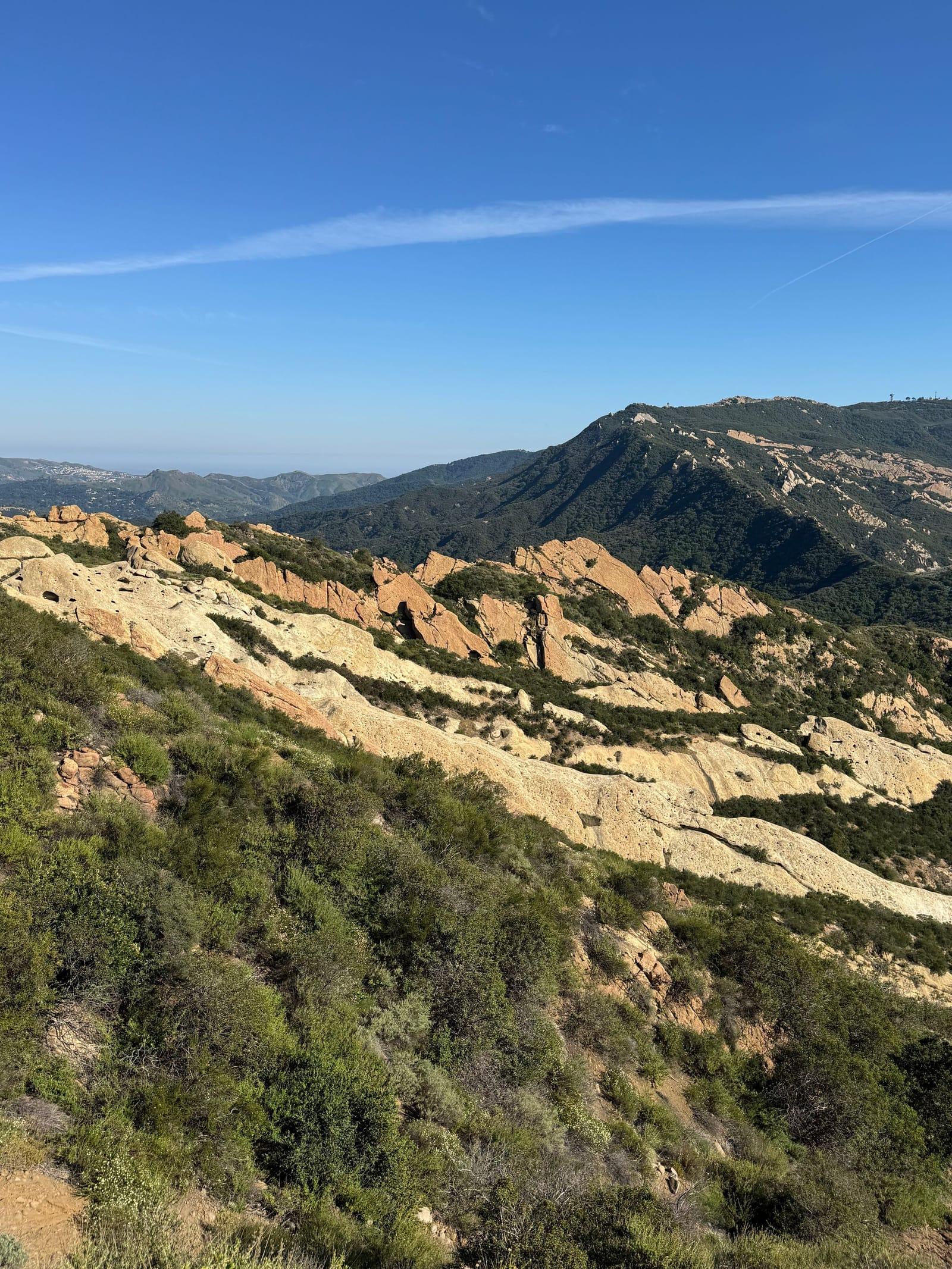 Rugged sandstone slopes in the Santa Monica Mountains under a blue sky