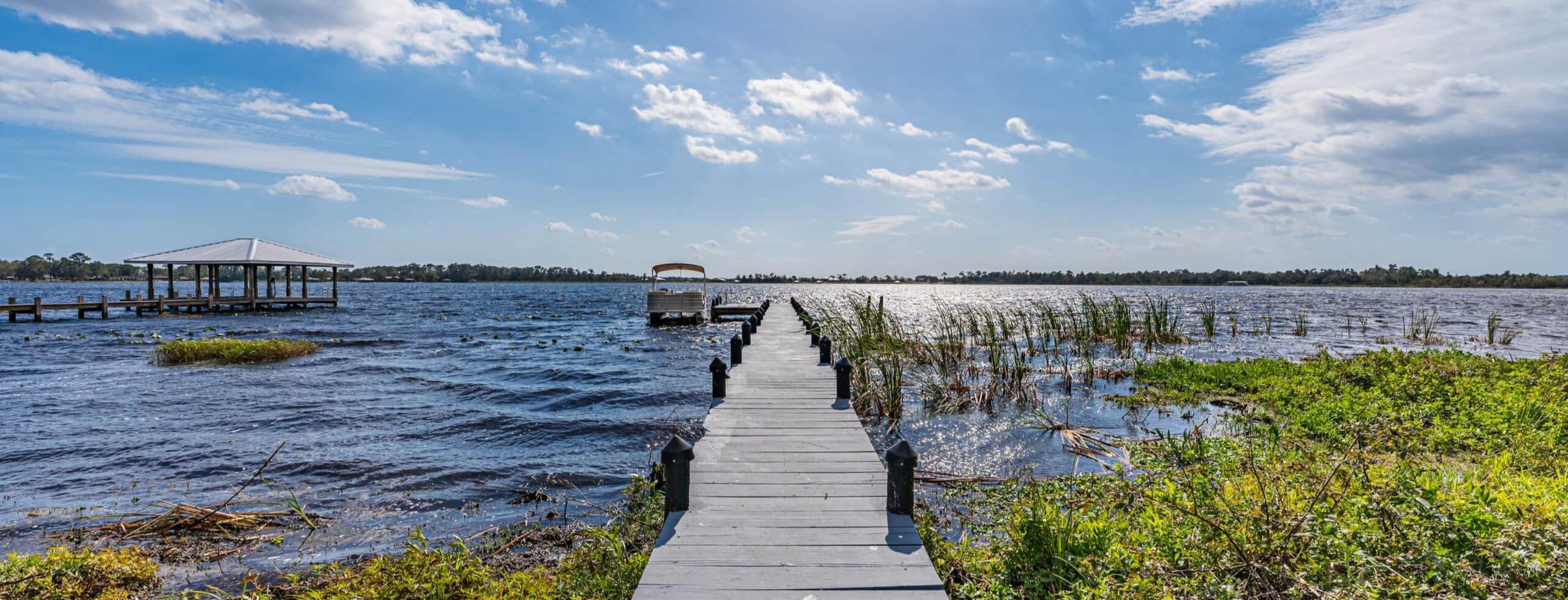 The dock and lakefront at Tikvah Lake Recovery's estate in Sebring, Florida