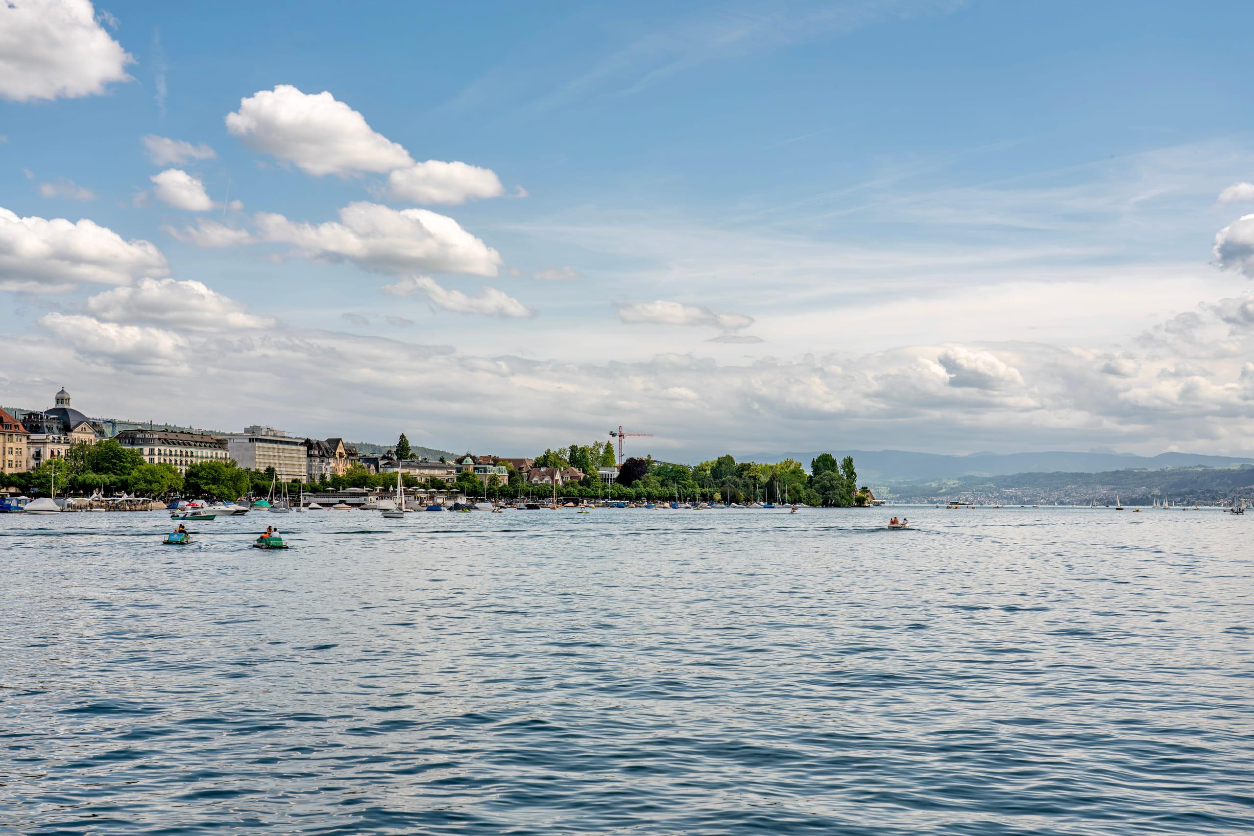 The Utoquai lakefront in Zurich, the Hotel Bellerive above moored boats on Lake Zurich