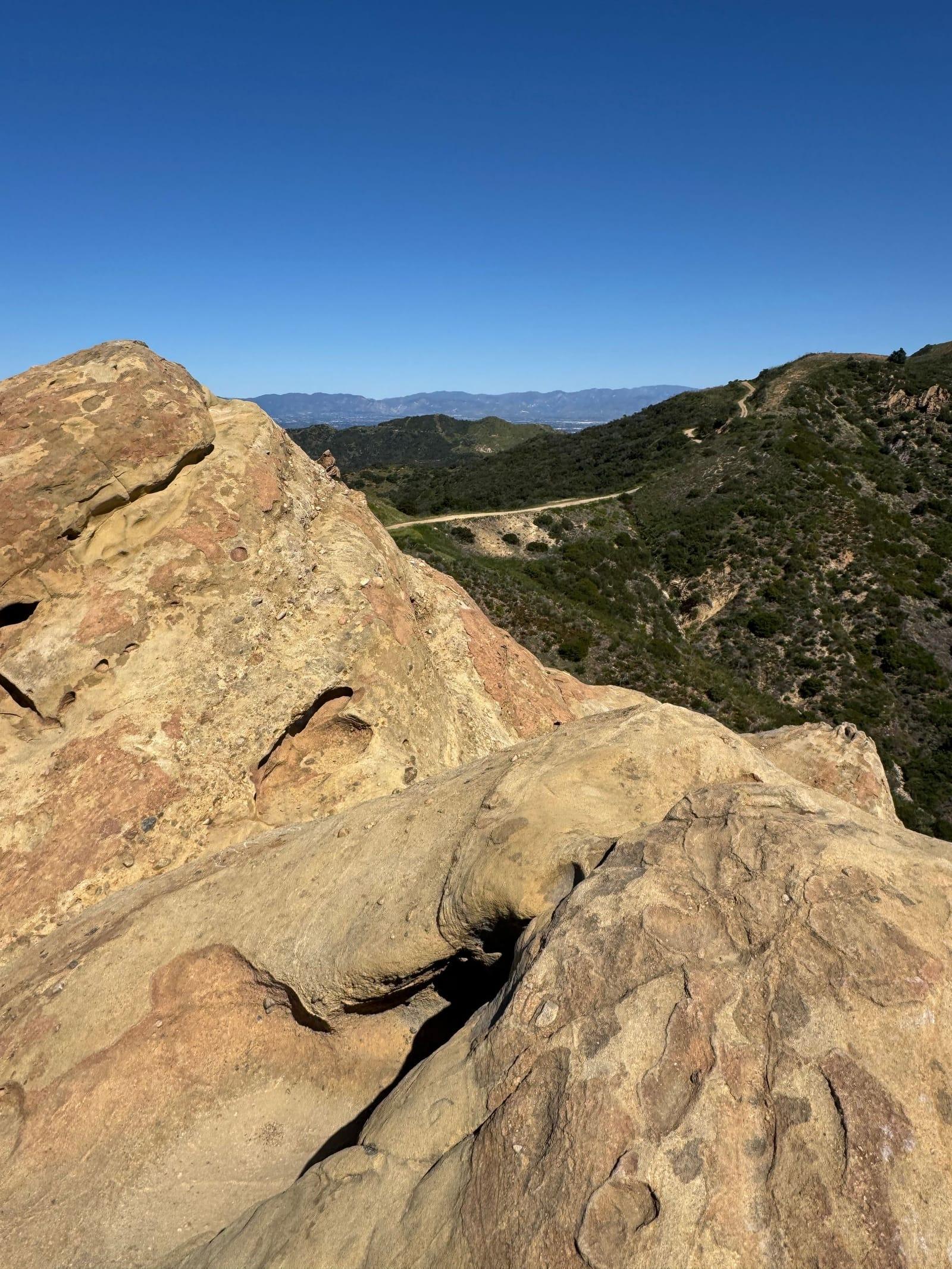 Weathered sandstone and distant ridges in the Santa Monica Mountains