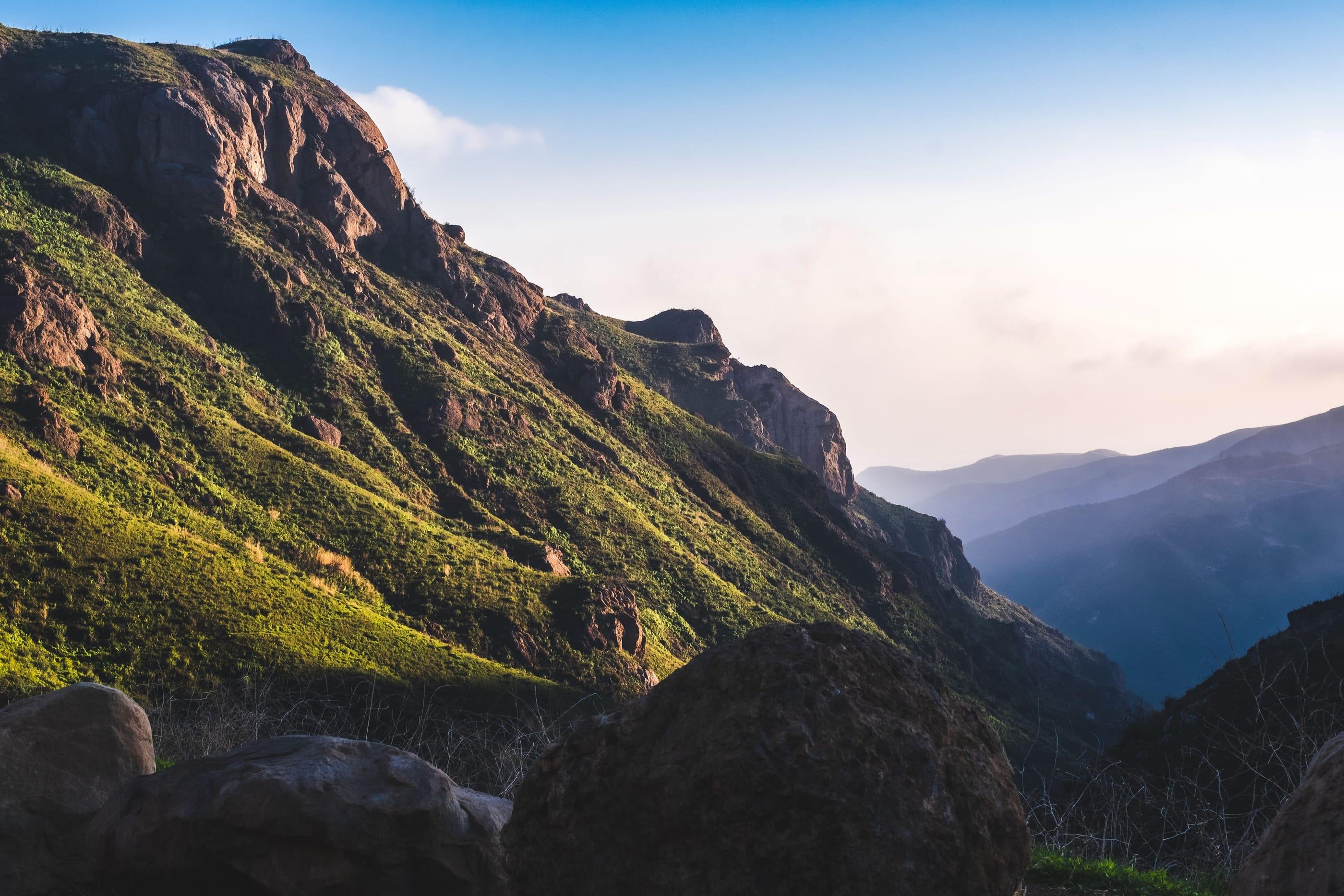 Sunlit ridges of the Santa Monica Mountains above Malibu, California, folding toward the coast
