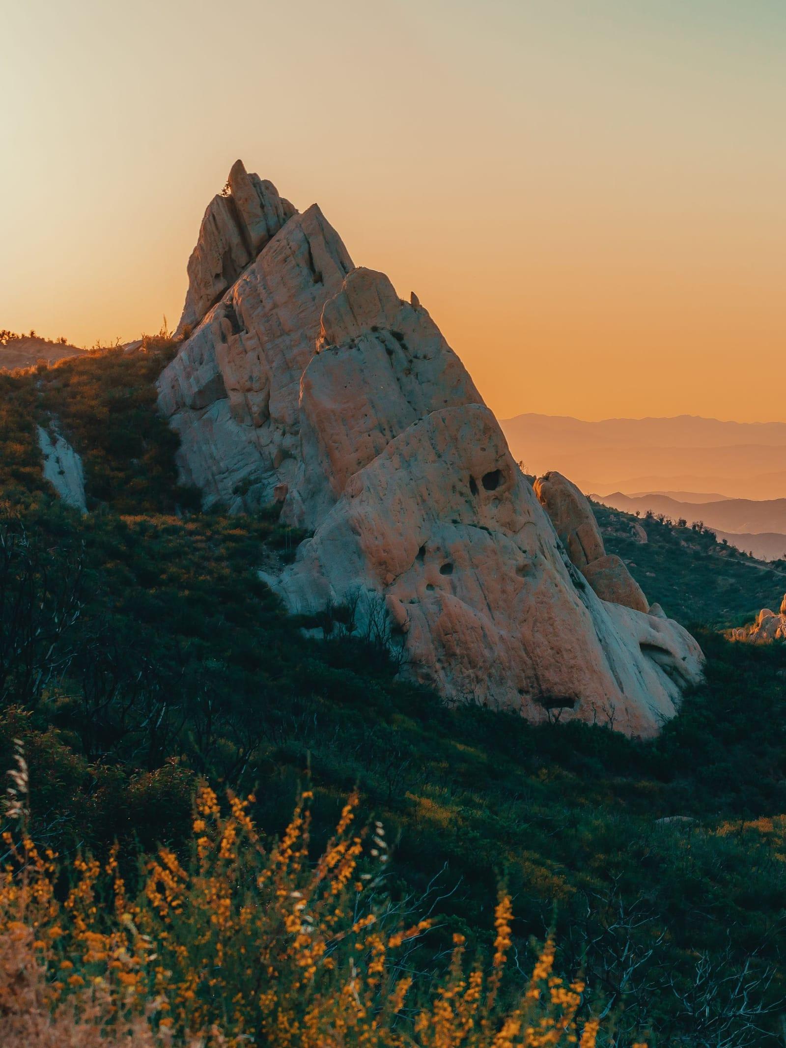 A rock spire catching the last light in the mountains above Malibu